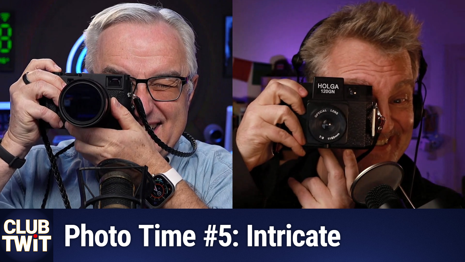 This is a side-by-side photograph of Leo and Chris, both holding vintage cameras. Leo on the left has white hair and wears a light blue shirt; Chis on the right has blonde hair and a black shirt. Both are smiling and looking at their cameras. The background features a dimly lit studio with a green and red light. Text reads "CLUB TWIT Photo Time #5. Intricate."