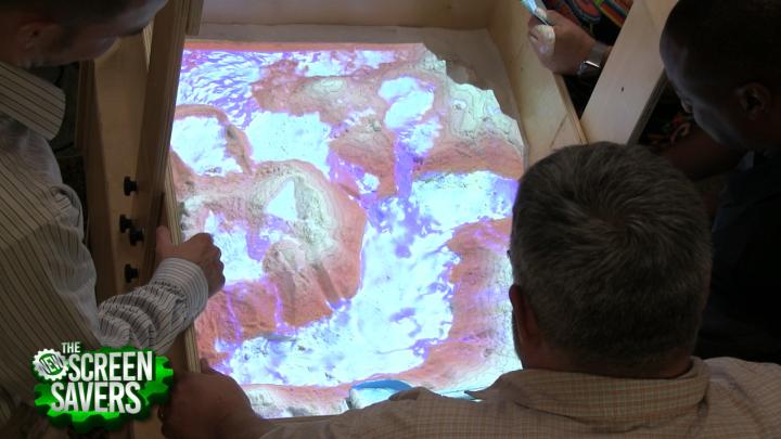 The AR Sandbox uses a projector and an Xbox Kinect to project topographical information onto a sandbox.