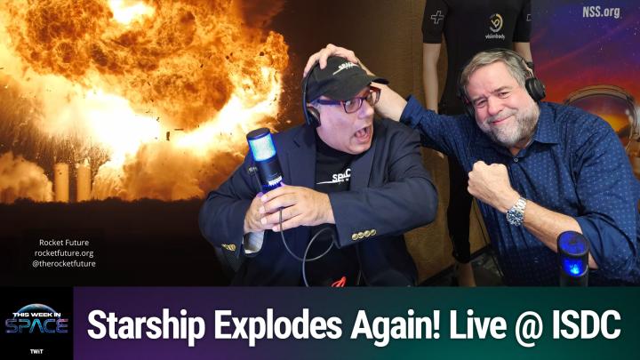 Two men recording a podcast in front of a dramatic rocket explosion image. The man on the left, wearing a headset, glasses, and a “SPACE.COM” hat, looks shocked while gripping a microphone. The man on the right, wearing a blue shirt and headphones, smiles playfully and has one hand on the other man’s head and his other fist raised. Text at the bottom reads: “Starship Explodes Again! Live @ ISDC” with the This Week in Space (TWiT) logo in the corner.